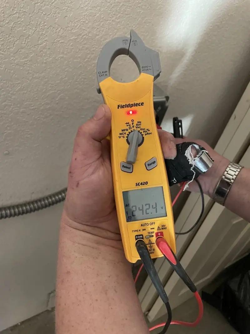 Voltage testing with clamp meter during Recessed Lighting Installation in Fairwood